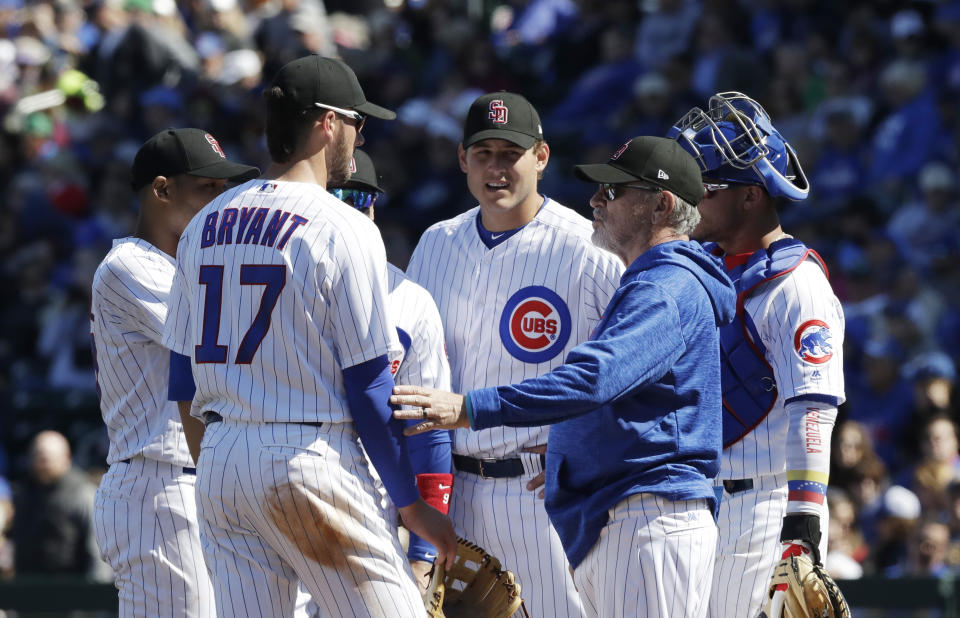 FILE – In this Feb. 24, 2018, file photo, Chicago Cubs manager Joe Maddon visits the mound during the second inning of a spring training baseball game against the Texas Rangers, in Mesa, Ariz. In the aftermath of Chicagos collapse last season, Cubs manager Joe Maddon went looking for a deeper understanding of the players who dominate the major leagues these days. Maddons search took him to Managing Millennials for Dummies, and the book reinforced what he already felt about the people he worked with every day.(AP Photo/Carlos Osorio, File)