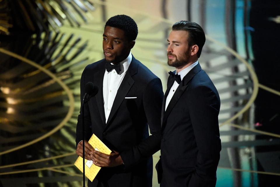 Feb 28, 2016; Hollywood, CA, USA; Chadwick Boseman (left) and Chris Evans present the Oscar for achievement in sound editing during the 88th annual Academy Awards at the Dolby Theatre. Mandatory Credit: Robert Deutsch-USA TODAY NETWORK 