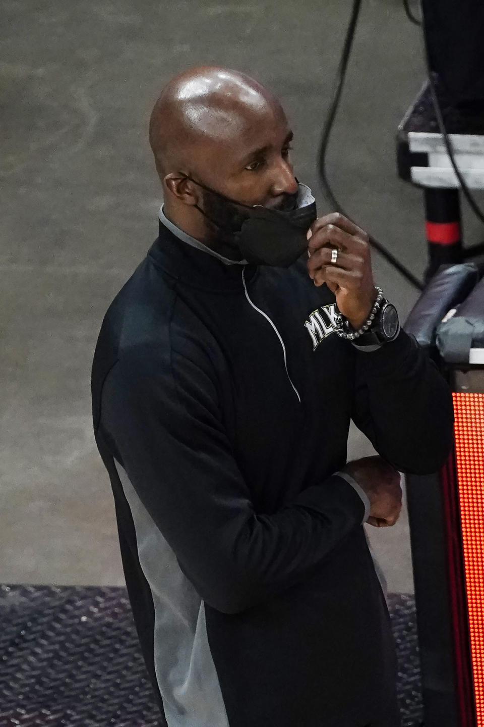 Atlanta Hawks head coach Lloyd Pierce talks to his players on the court in the second half of an NBA basketball game against the Boston Celtics Wednesday, Feb. 24, 2021, in Atlanta. (AP Photo/John Bazemore)