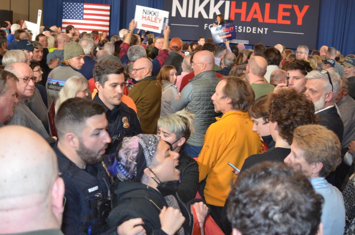 A protester is removed by police in the midst of Nikki Haley's rally in South Burlington, March 3, 2024. The protester was chanting "Ceasefire now."