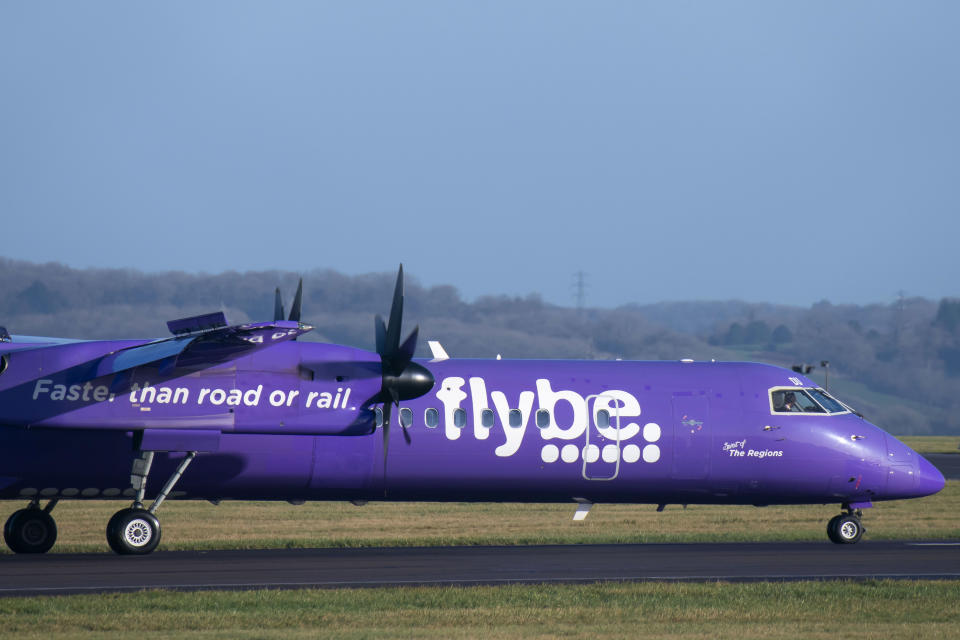 CARDIFF, WALES - JANUARY 18: A Flybe Bombardier DHC-8 Q400 aircraft at Cardiff Airport on January 18, 2020 in Cardiff, United Kingdom. British airline Flybe, who account for 36% of UK domestic flights, have struck a deal with the UK government to defer tax payments and have received increased funding from owners Connect Airways. The UK government also agreed to conduct an urgent review of Air Passenger Duty on domestic flights. (Photo by Matthew Horwood/Getty Images)