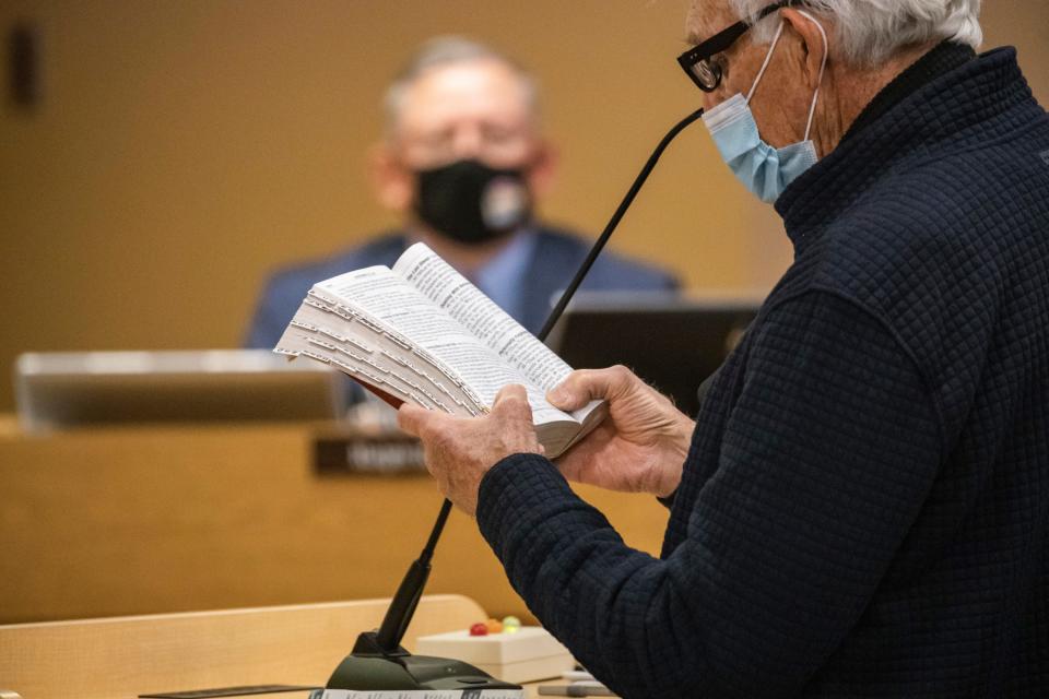 Charles Wendler, who has previously run for seats on the state legislature, Doña Ana County Commission and Las Cruces Public Schools Board of Education, reads from the Bible at the Las Cruces Public Schools board meeting on Jan. 4. Wendler spoke out against the district’s gender inclusion policy.