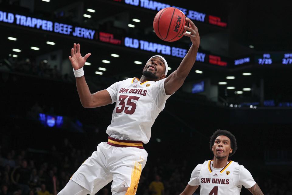 Nov 17, 2022; Brooklyn, New York, USA; Arizona State Sun Devils guard Devan Cambridge (35) rebounds in front of guard Desmond Cambridge Jr. (4) during the first half against the Michigan Wolverines at Barclays Center.