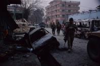 <p>Afghan security forces inspect the site of attack on British charity Save the Children office in Jalalabad on Jan. 24, 2018. (Photo: Noorullah Shirzada/AFP/Getty Images) </p>