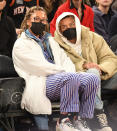 <p>Naomi Osaka and boyfriend Cordae sit courtside at the New York Knicks vs. the Atlanta Hawks game at Madison Square Garden on Christmas. </p>