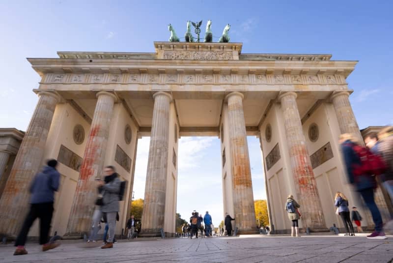 Traces of paint can be seen on the pillars of the Brandenburg Gate after the paint attack by climate activists. Around five months after a paint attack on the Brandenburg Gate, the state of Berlin is demanding some €142,000 ($152,170) in compensation from the climate activists responsible. Monika Skolimowska/dpa