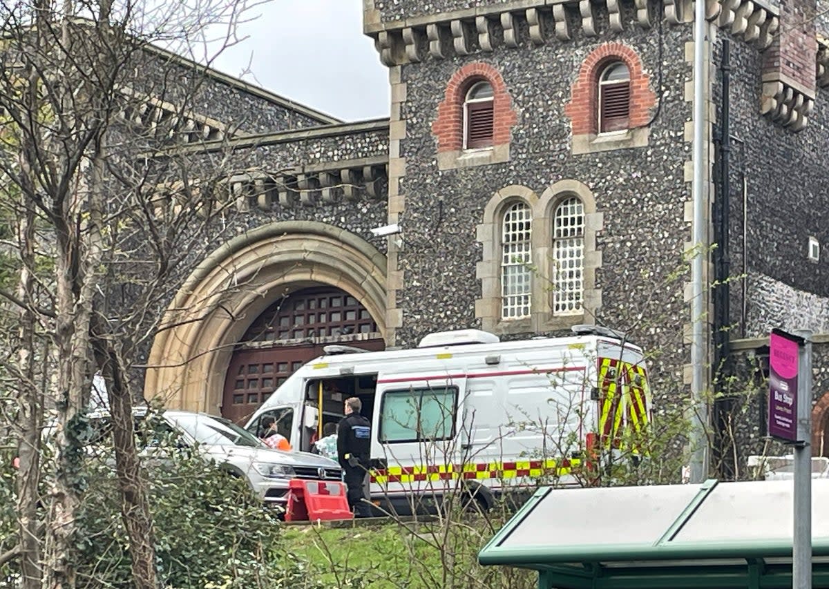 Emergency personnel outside HMP Lewes after several prisoners are believed to have become unwell after getting food poisoning   (Anahita Hossein-Pour/PA Wire)