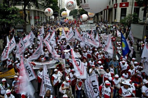 Activists take part in the "Global March" in Rio de Janeiro, Brazil. World leaders gathered in Rio on Wednesday weighed steps to root out poverty and protect the environment as UN chief Ban Ki-moon warned that "time is not on our side" for fixing a mounting list of problems