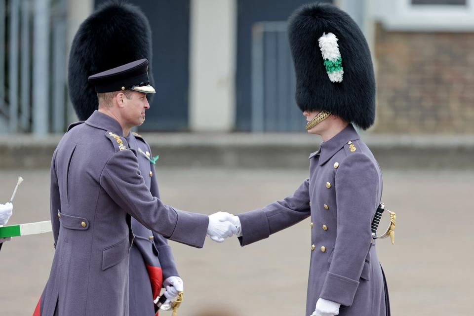 Prince William, Prince of Wales shakes hands with a member of the 1st Battalion Welsh Guards at Combermere Barracks for the St David’s Day Parade