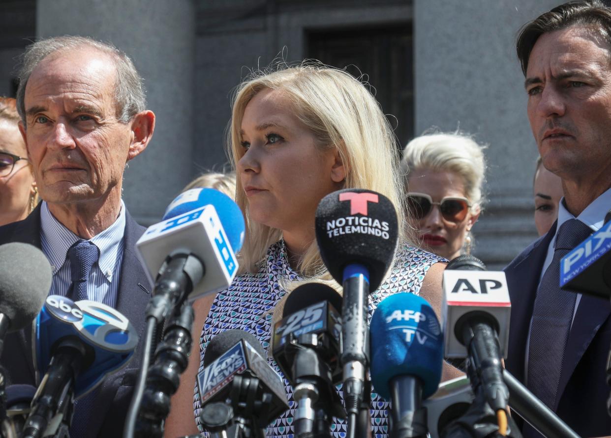 Virginia Giuffre, center, who says she was trafficked by sex offender Jeffrey Epstein, has sued Prince Andrew, saying he sexually assaulted her when she was 17.