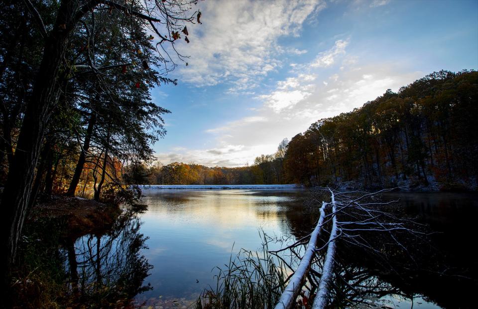 It was a snowy sunrise over Tom Wallace lake in Jefferson Memorial Forest on Tuesday morning. November 12, 2019