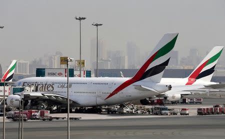 FILE PHOTO: Emirates Airlines aircraft are seen at Dubai International Airport, United Arab Emirates May 10, 2016. REUTERS/Ashraf Mohammad/File Photo