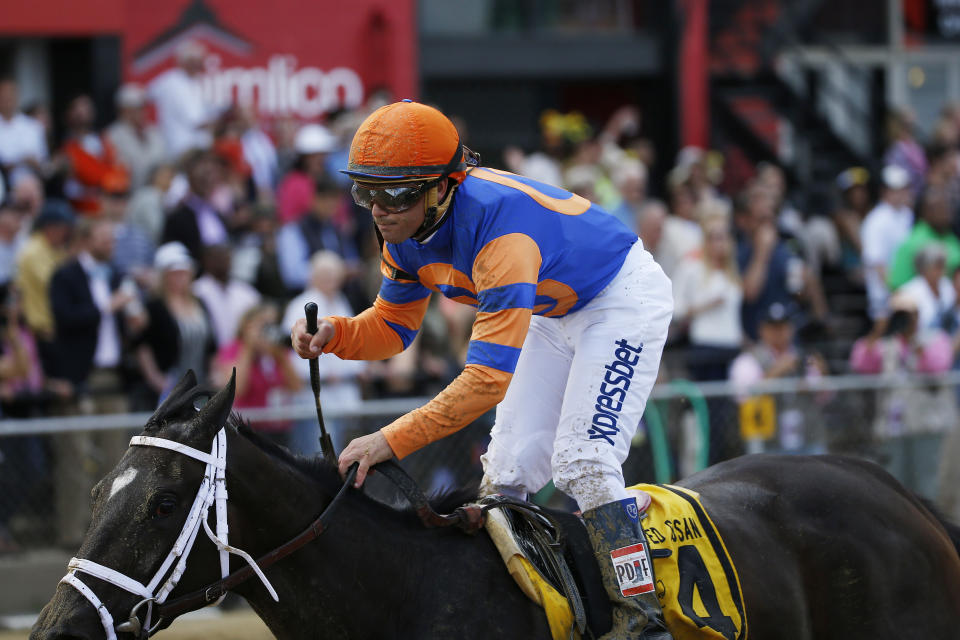 FILE - Fortune Pearl with Trevor McCarthy atop races at Pimlico Race Course on May 16, 2014, in Baltimore. Earlier in 2023, horse racing was rocked by the deaths less than six weeks apart of two young jockeys, 23-year-old Avery Whisman and 29-year-old Alex Canchari, each of whom killed himself. McCarthy in 2022, like da Silva before him, sought help before it was too late. (AP Photo/Matt Slocum, File)