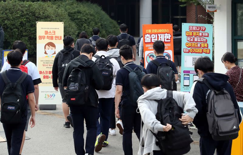 High school students arrive at a high school, amid the coronavirus disease (COVID-19) pandemic, in Seoul