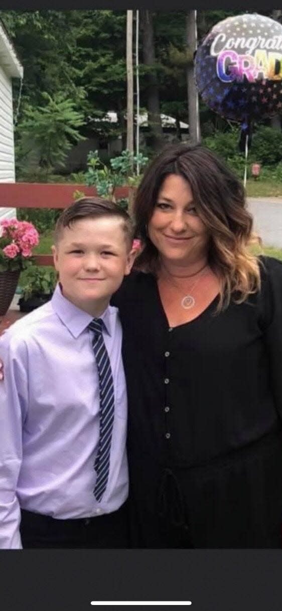 Tyler Gilbert, 12, poses with his mother, Christie, during his 6th grade graduation party. Two months later, he was killed by his father in Hinsdale.