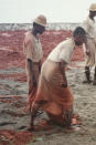 This late 2000s photo provided by the Assistance Association of Political Prisons for Myanmar shows men in a labor camp in Upper Burma. The military has a long history of torture, particularly before the country began transitioning toward democracy in 2010. (AAPP via AP)