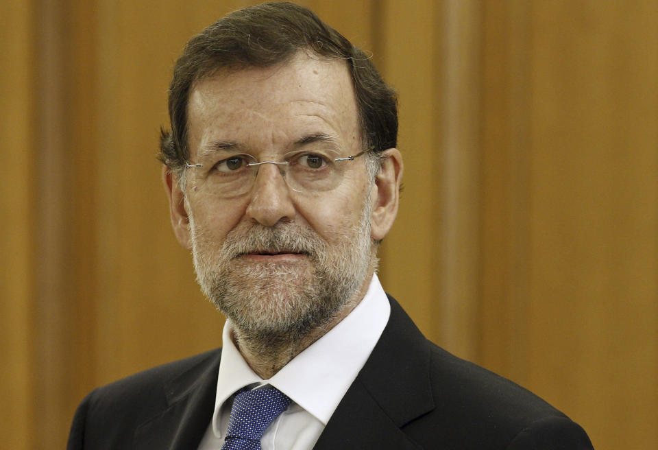 Spain's Prime Minister Mariano Rajoy looks on during a ceremony at the Zarzuela Palace in Madrid Monday, June 23, 2012. Spain’s market regulator says it has temporarily banned short-selling of shares on its stock indexes owing to volatility in Spanish and European markets.The country’s CNMV stock market watchdog said the measure would be kept in place for three months. It noted that Italy took similar steps Monday. (AP Photo/Ballesteros, Pool)