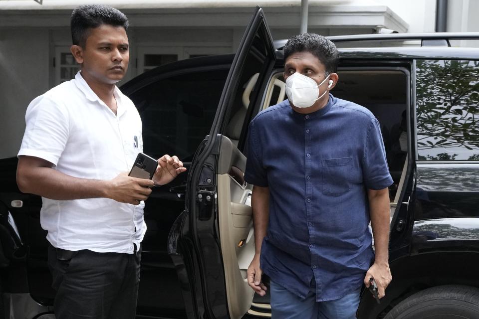 Sri Lankan opposition leader Sajith Premadasa arrives for an interview with The Associated Press at his office in Colombo, Sri Lanka, Friday, July 15, 2022. Premadasa, who is seeking the presidency next week, vowed Friday to “listen to the people” who are struggling through the island nation’s worst economic crisis and to hold accountable the president who fled under pressure from protesters. (AP Photo/Eranga Jayawardena)