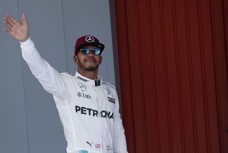 Formula One - Spanish Grand Prix - Barcelona-Catalunya racetrack, Montmelo, Spain - 14/5/16 Mercedes F1 driver Lewis Hamilton of Britain celebrates pole position. REUTERS/Juan Medina