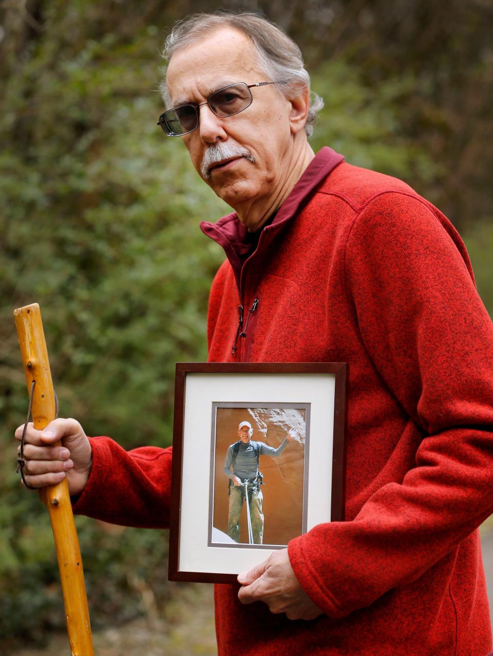 David Cicotello, of Murfreesboro, holds a photograph of his older brother Louis Cicotello. Louis Cicotello fell to his death during a day hike that the two went on. After the fall David Cicotello survived six days stranded in a slot canyon in Utah in 2011, before he was rescued.