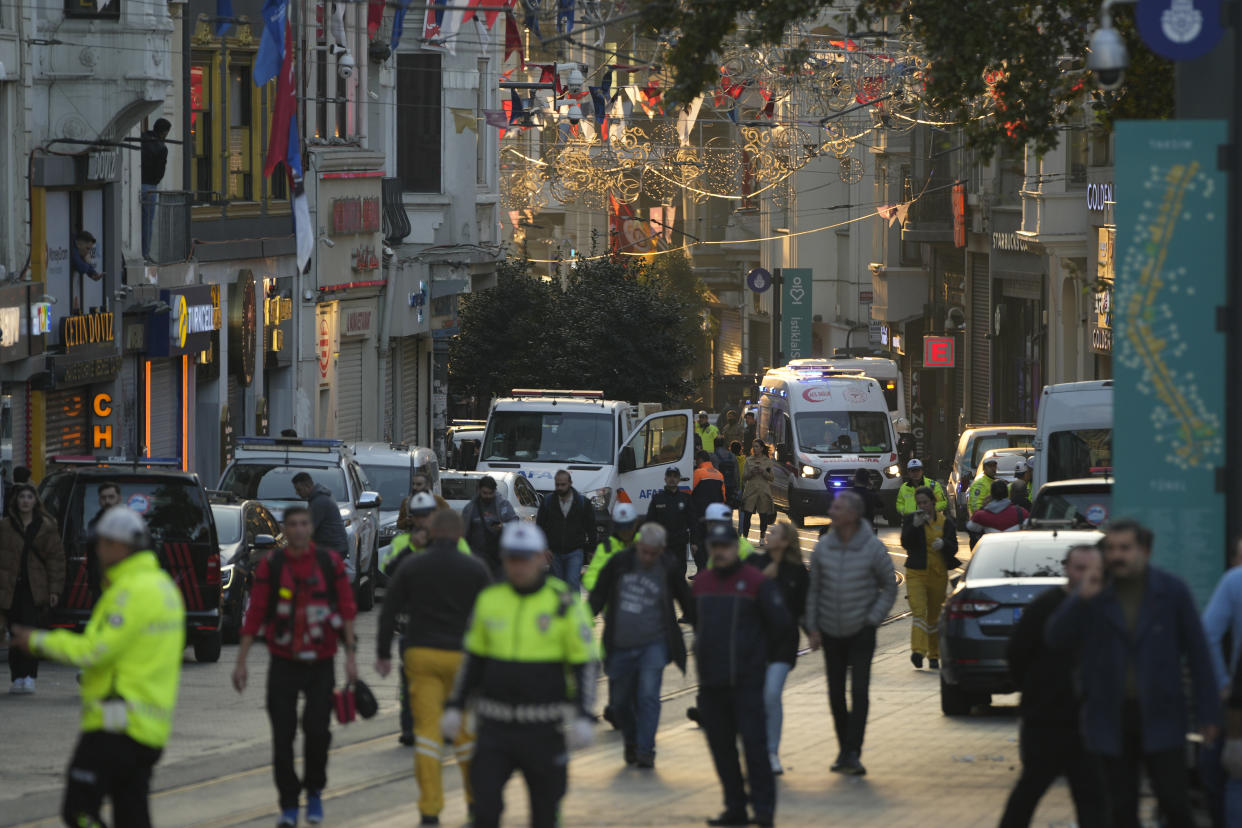 Security and ambulances at the scene after an explosion on Istanbul's popular pedestrian Istiklal Avenue, Sunday, Nov. 13, 2022. Istanbul Gov. Ali Yerlikaya tweeted that the explosion occurred at about 4:20 p.m. (1320 GMT) and that there were deaths and injuries, but he did not say how many. The cause of the explosion was not clear. (AP Photo/Francisco Seco)