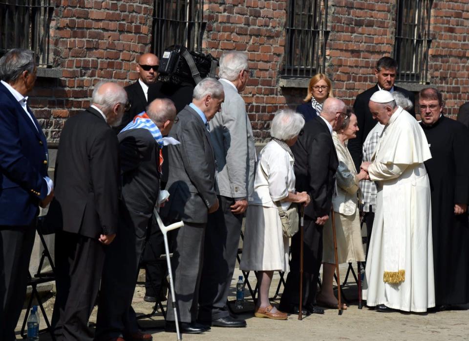 Pope Francis ® meets with former Auschwitz prisoners in a yard area next to the Death Wall in the former Nazi German concentration camp Auschwitz I in Oswiecim, Poland, 29 July 2016. Pope Francis visited the site of former Nazi German concentration camp Auschwitz II - Birkenau, as part of his visit to Poland. (EPA/RADEK PIETRUSZKA POLAND OUT)