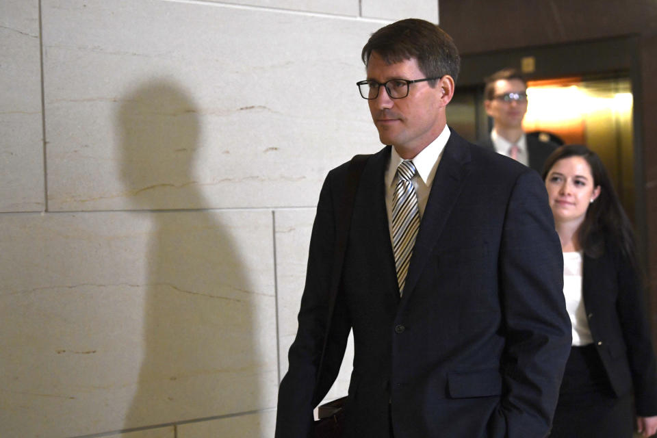 Christopher Anderson, a career foreign service officer in the State Department, arrives to review his testimony during a closed-door interview on Capitol Hill in Washington, Thursday, Nov. 7, 2019, in the impeachment inquiry on President Donald Trump's efforts to press Ukraine to investigate his political rival, Joe Biden. (AP Photo/Susan Walsh)