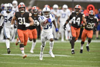 Indianapolis Colts cornerback Isaiah Rodgers (34) returns a kickoff for 101-yard touchdown during the second half of an NFL football game against the Cleveland Browns, Sunday, Oct. 11, 2020, in Cleveland. (AP Photo/David Richard)