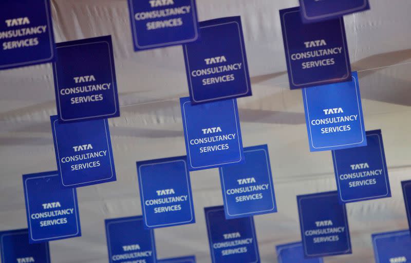 Logos of TCS are displayed at the venue of the annual general meeting of the software services provider in Mumbai
