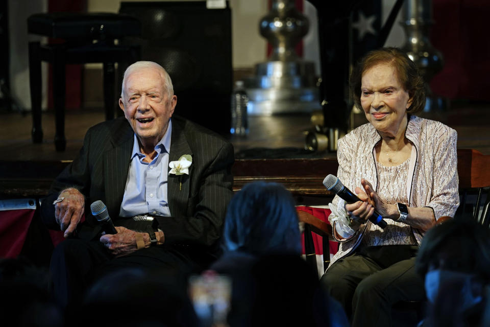 FILE - Former President Jimmy Carter and his wife former first lady Rosalynn Carter sit together during a reception to celebrate their 75th wedding anniversary Saturday, July 10, 2021, in Plains, Ga. Rosalynn Carter, the 96-year-old former first lady, is in hospice care at home, the Carter Center says. (AP Photo/John Bazemore, Pool, File)