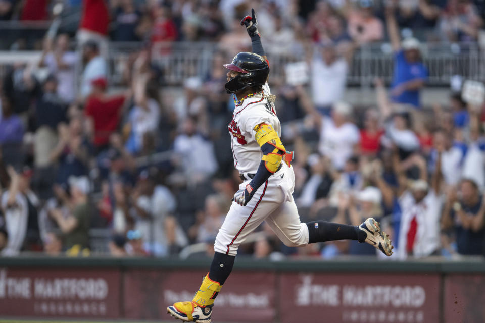 FILE - Atlanta Braves' Ronald Acuña Jr. gestures while running bases on a solo home run against the St. Louis Cardinals during the first inning of a baseball game Sept. 7, 2023, in Atlanta. Acuña has been the favorite in the NL MVP race for months. He's the catalyst for a robust Braves offense that leads the big leagues by scoring nearly six runs per game. The 25-year-old outfielder even created his very own club this season, becoming the one and only player in MLB history with at least 30 homers and 60 stolen bases. (AP Photo/Hakim Wright Sr., File)