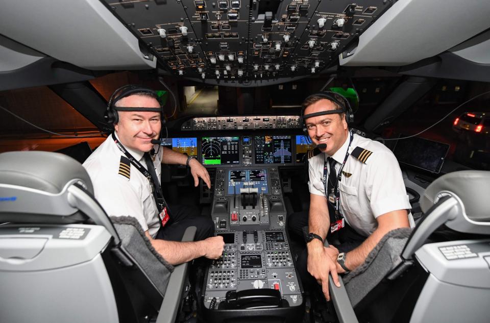 Pilots captain Sean Golding (left) and first officer Jeremy Sutherland in the cockpit of the Boeing 787 liner (QANTAS/AFP via Getty Images)