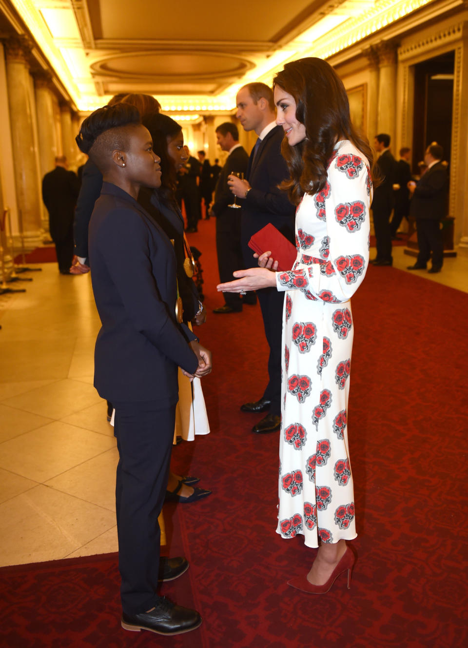 <p>Looking every inch the style queen in a long, poppy print Alexander McQueen dress, the Duchess greeted members of Team GB - including boxer Nicola Adams.</p><p><i>[Photo: PA Images]</i></p>