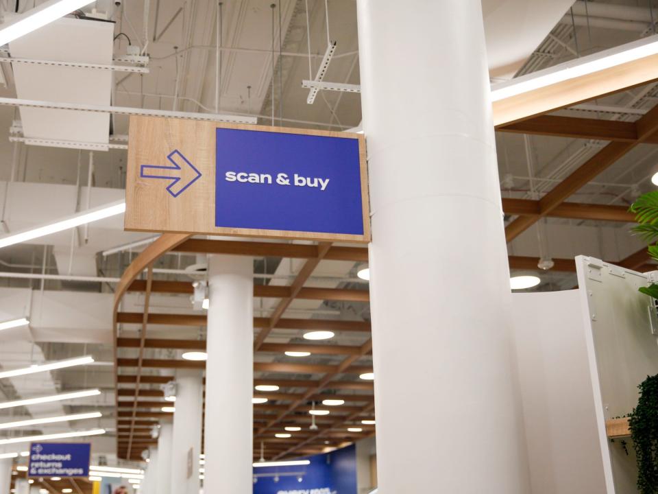 a sign that says "scan and buy"