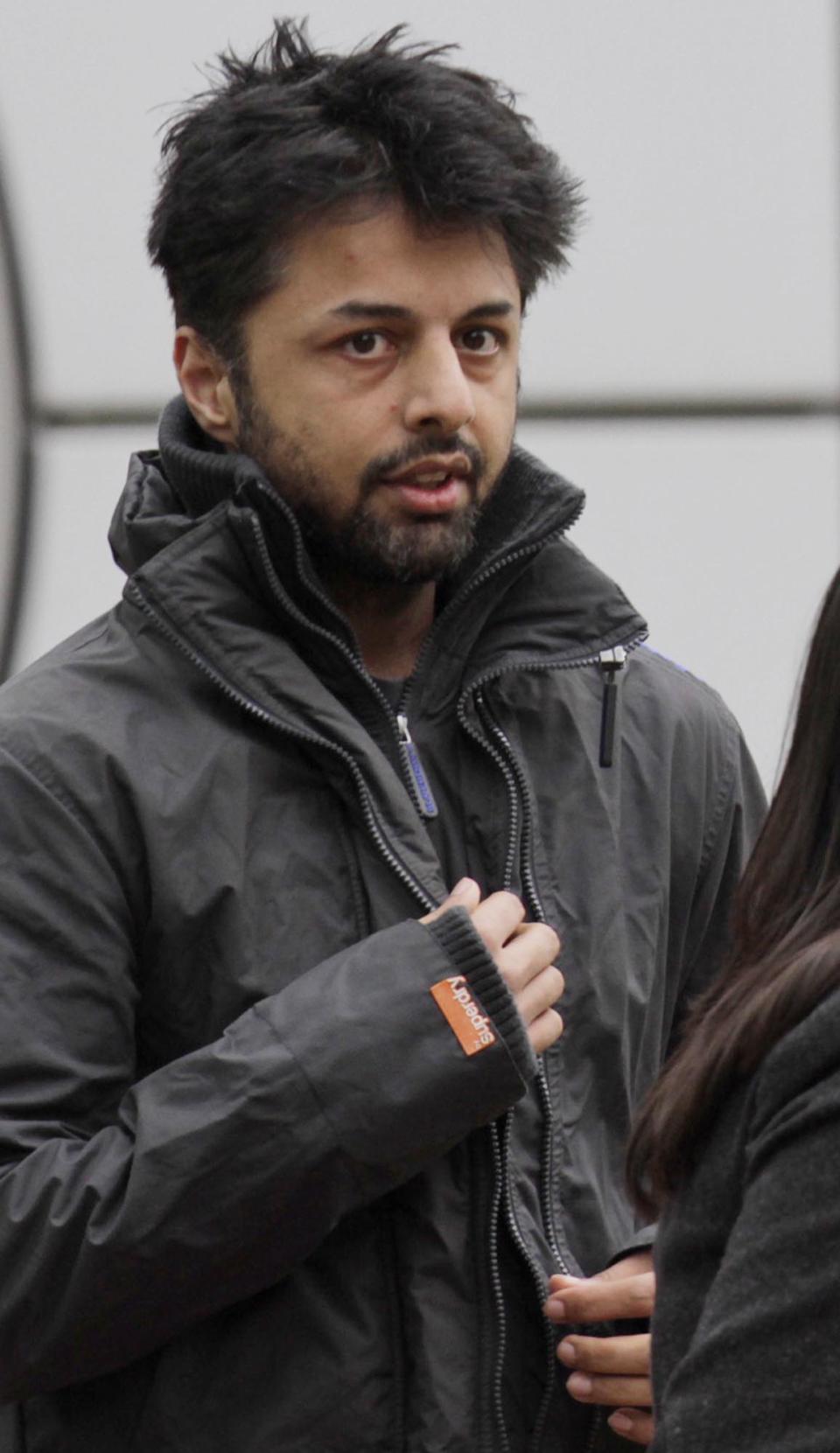 FILE - In this file photo dated July 18, 2011, Shrien Dewani leaves Belmarsh Magistrates' Court, during his extradition case in south London. Murder suspect Shrien Dewani has lost his bid to block his extradition to South Africa, where he's accused of arranging the murder of his new wife, Anni, during a honeymoon trip in 2010. The case has drawn attention in both countries, and has been dragged out by legal wrangling in Britain over whether Dewani is fit to be removed from the country. Dewani denies the charges, and his lawyers argue that he suffers post-traumatic stress and depression and should not be extradited. Britain's High Court on Friday, Jan. 31, 2014, approved Dewani's removal so long as South African authorities could give a guarantee as to how long he would be kept there without trial. The court had been told the South Africans were willing to do so. (AP Photo/Lefteris Pitarakis, file)