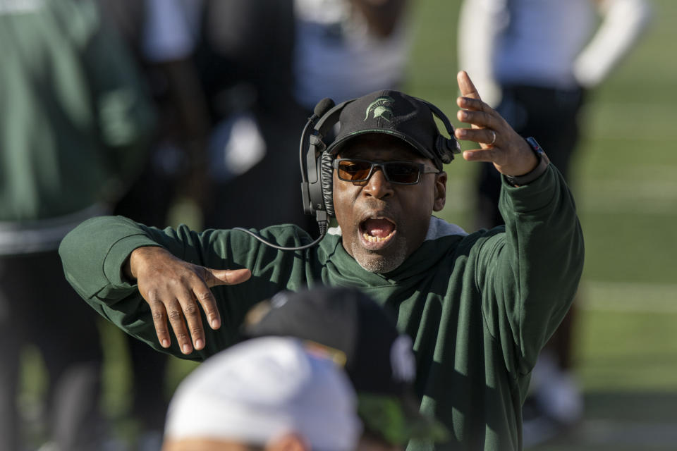 Michigan State interim head coach Harlon Barnett gestures during the second half of an NCAA college football game against Indiana, Saturday, Nov. 18, 2023, in Bloomington, Ind. (AP Photo/Doug McSchooler)