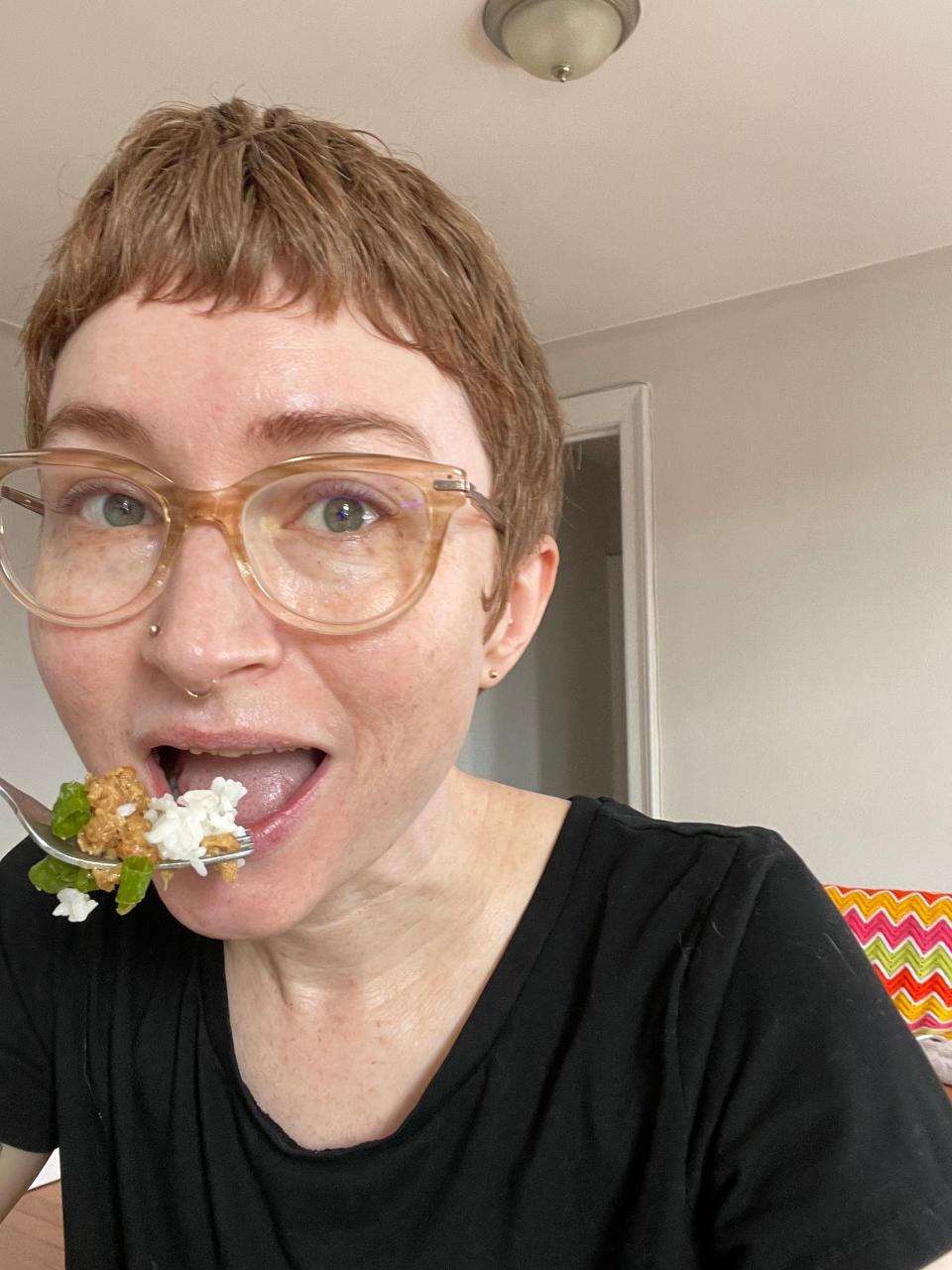 Megan takes a bite of rice with natto and green onion