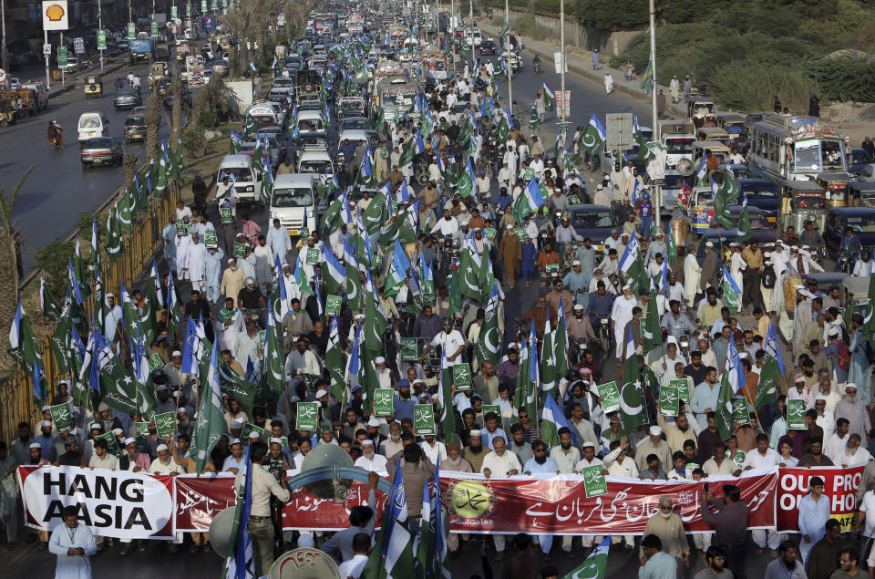 FILE - In this Nov. 4, 2018, file photo, supporters of Jamaat-i-Islami, a Pakistani Islamist party, participate in a rally to condemn a Supreme Court decision that acquitted a Christian woman, in Karachi, Pakistan. Aasia Bibi, Christian woman acquitted after eight years on death row for blasphemy was released but her whereabouts in Islamabad on Thursday remained a closely guarded secret in the wake of demands by radical Islamists that she be publicly executed. (AP Photo/Fareed Khan)