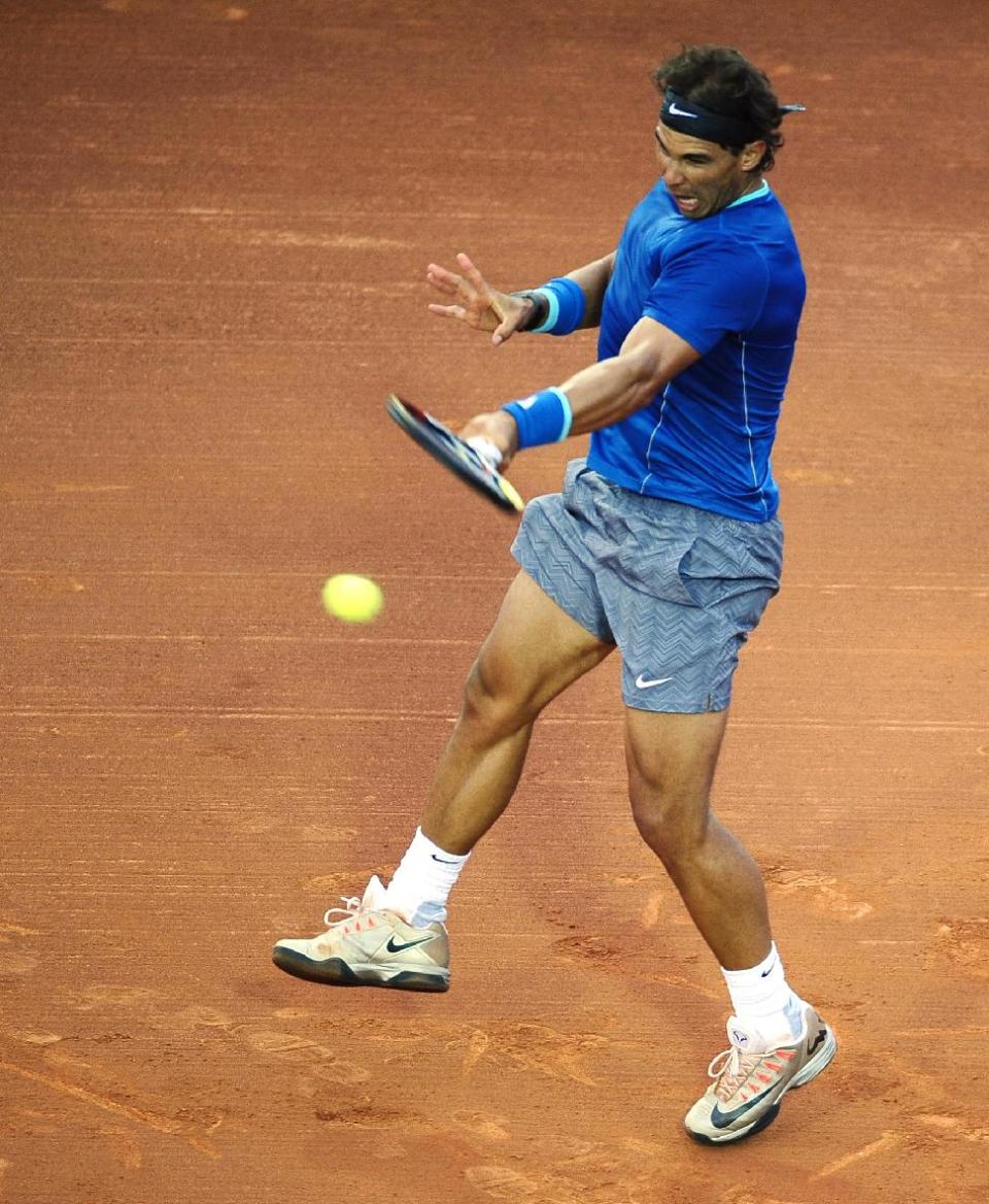 Rafael Nadal of Spain returns the ball to Ivan Dodig from Croatia, during the Barcelona open tennis in Barcelona, Spain, Thursday, April 24, 2014. (AP Photo/Manu Fernandez)