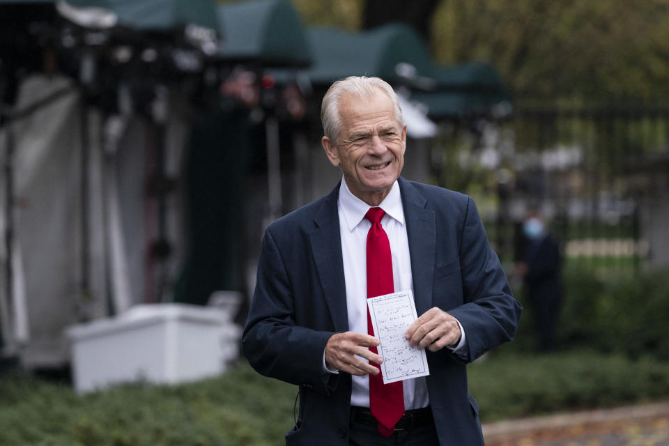 FILE - White House trade adviser Peter Navarro holds his notes after a television interview at the White House, Monday, Oct. 12, 2020, in Washington. The House committee investigating the Jan. 6 attack on the U.S. Capitol is pushing ahead with contempt charges against former Trump advisers Peter Navarro and Dan Scavino in response to their monthslong refusal to comply with subpoenas. (AP Photo/Alex Brandon, File)