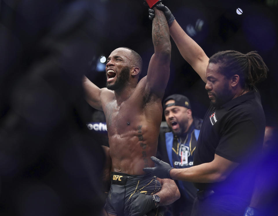 Leon Edwards celebrates his victory over Kamaru Usman in the the welterweight title bout at the UFC 286 mixed martial arts event Saturday, March 18, 2023, in London. (Kieran Cleeves/PA via AP)