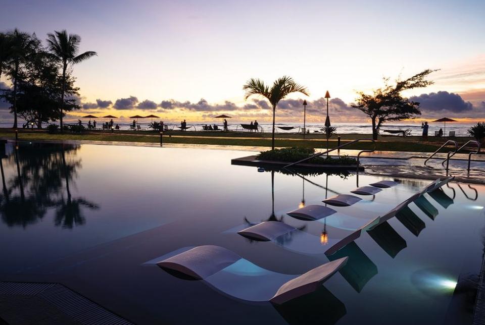 Sunrise at the Sheraton Kauai Coconut Beach Resort's infinity pool