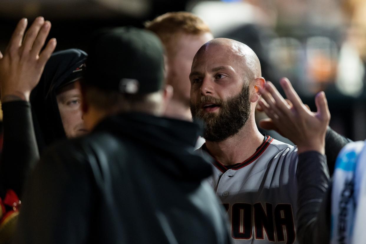 Sep 30, 2021; San Francisco, California, USA; Arizona Diamondbacks first baseman Christian Walker (53) celebrates in the dugout after scoring against the San Francisco Giants in the fifth inning at Oracle Park. Mandatory Credit: John Hefti-USA TODAY Sports