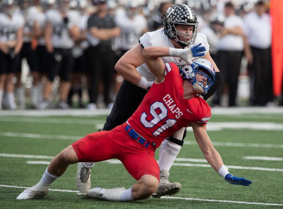 Two of the top players in Central Texas will play at the next level. Westlake defensive end Colton Vasek (in red) will play at Texas. Vandegrift lineman Ian Reed has followed former Westlake quarterback Cade Klubnik at Clemson.