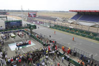 The Toyota TS050 Hybrid No8 of the Toyota Gazoo Racing Team's drivers Sebastien Buemi of Switzerland, Kazuki Nakajima of Japan and Brendon Hartley celebrate after crossing the finish line to win the 88th 24-hour Le Mans endurance race, in Le Mans, western France, Sunday, Sept. 20, 2020. Due to coronavirus crisis, the race takes place without spectators. (AP Photo/David Vincent)