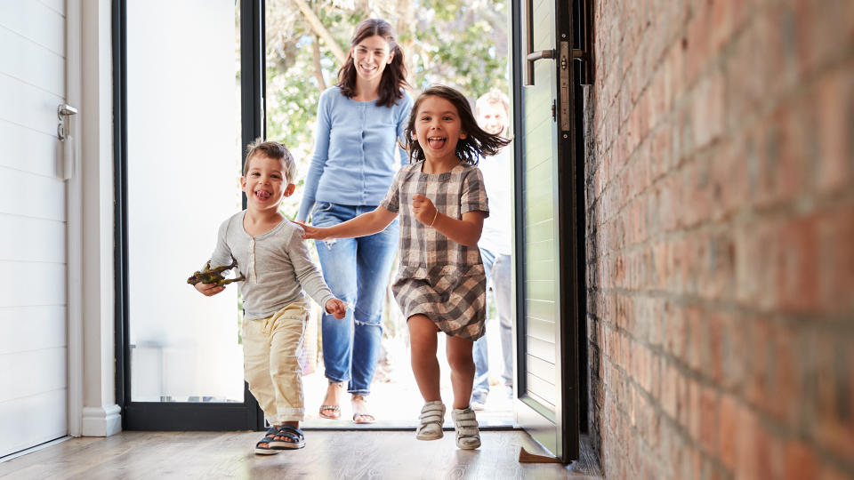 Excited Children Arriving Home With Parents - Image.