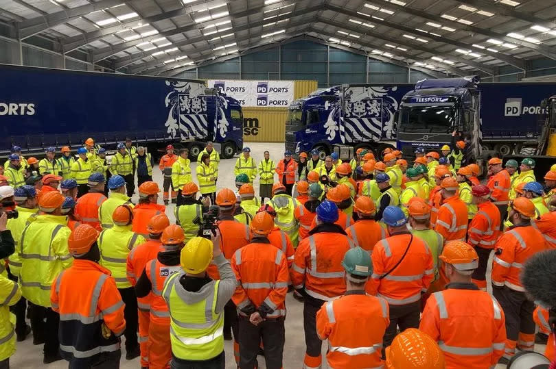 Around 100 port workers gathered for the huddle in a warehouse beside the River Tees