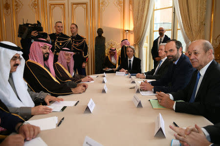 French Prime Minister Edouard Philippe (2ndR), flanked by French Minister of Europe and Foreign Affairs Jean-Yves Le Drian, attends a meeting with Saudi Arabia's Crown Prince Mohammed bin Salman upon his arrival at the Hotel de Matignon in Paris, France, April 9, 2018. Eric Feferberg/Pool via Reuters