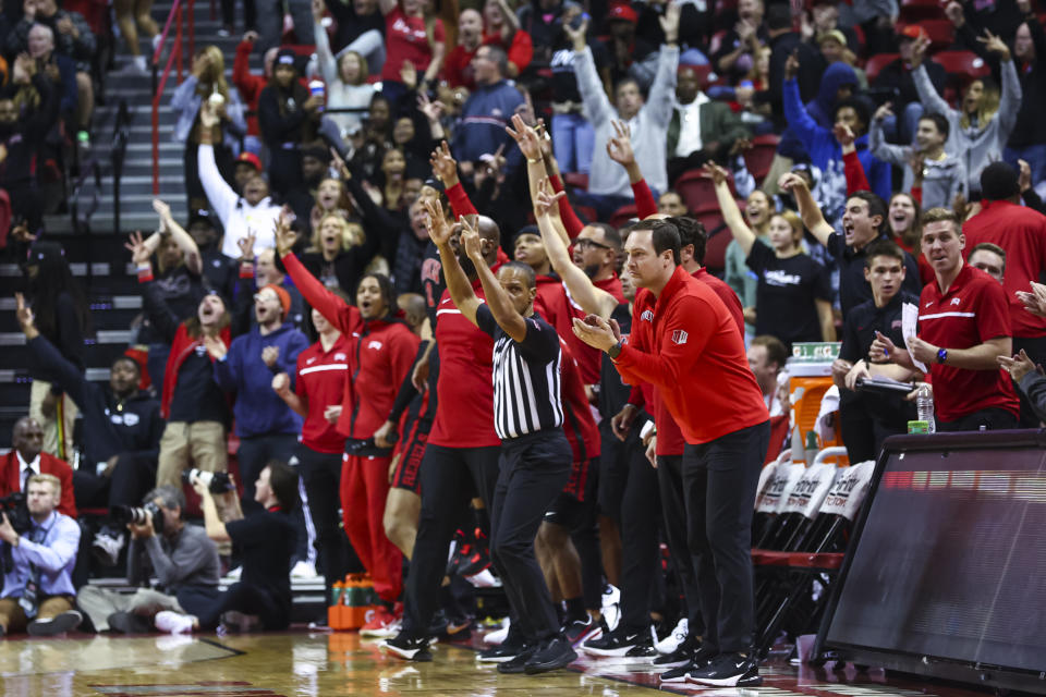 UNLV head coach Kevin Kruger claps as fans and staff cheer during the second half of an NCAA college basketball game against Dayton Tuesday, Nov. 15, 2022, in Las Vegas. (AP Photo/Chase Stevens)