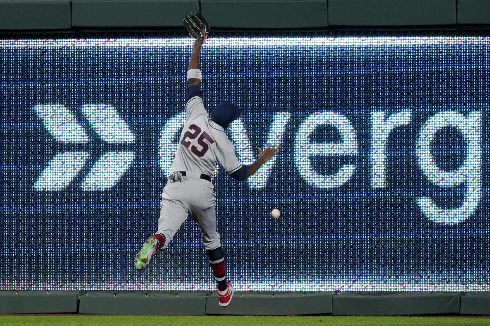 St. Louis Cardinals right fielder Dexter Fowler can't catch a fly ball by Kansas City Royals' Adalberto Mondesi that went for a triple during the first inning of a baseball game Tuesday, Sept. 22, 2020, in Kansas City, Mo. (AP Photo/Charlie Riedel)